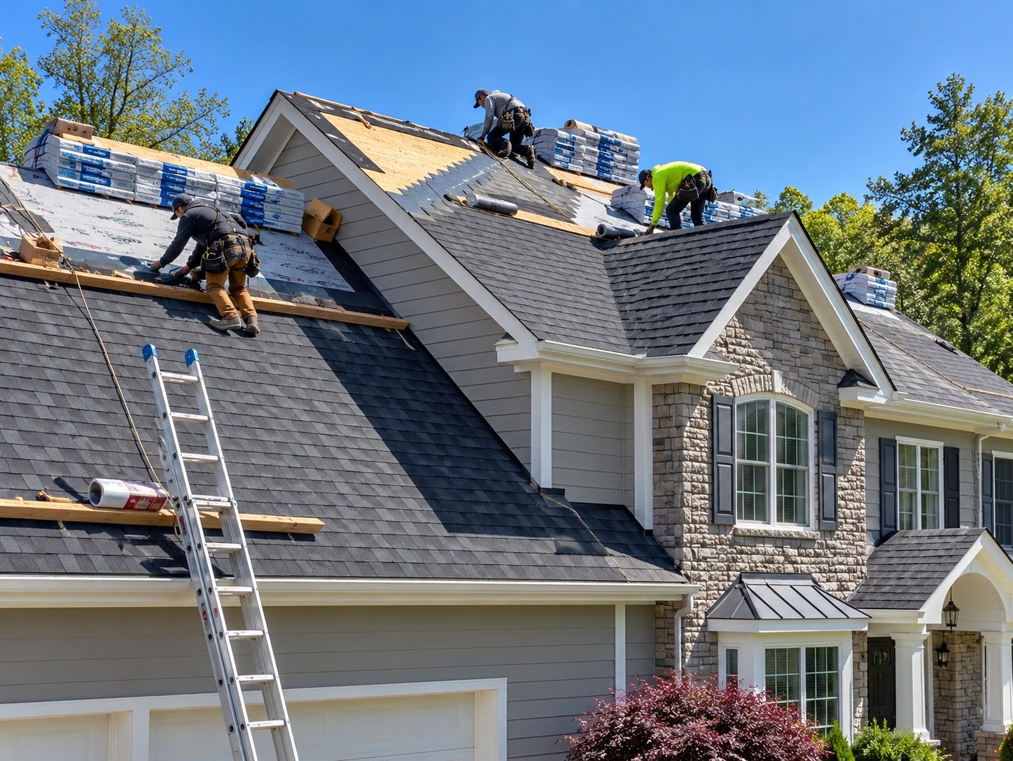 Roofing installation in progress with professional crew working on shingles